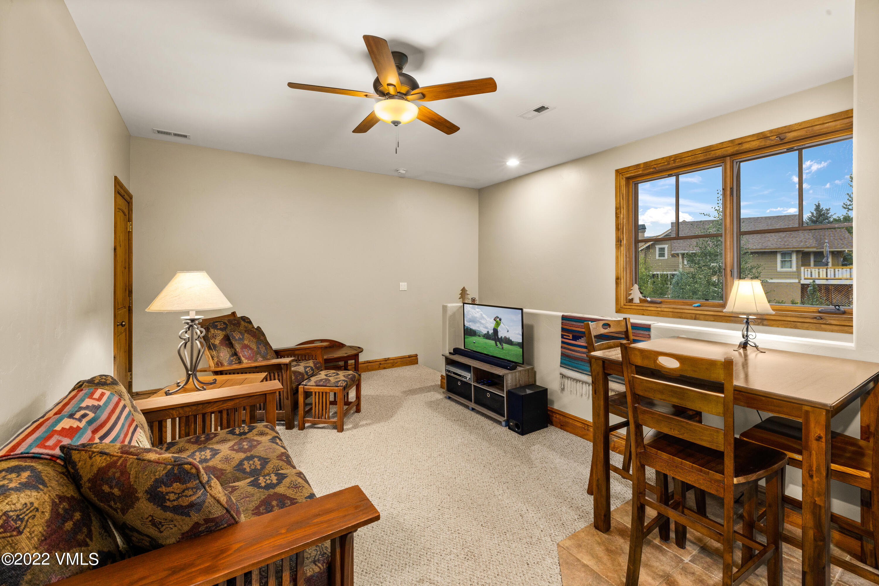 2376 Eagle Ranch Road Eagle, CO 81631 - Photo 40 of 52 a living room with furniture and a flat screen tv