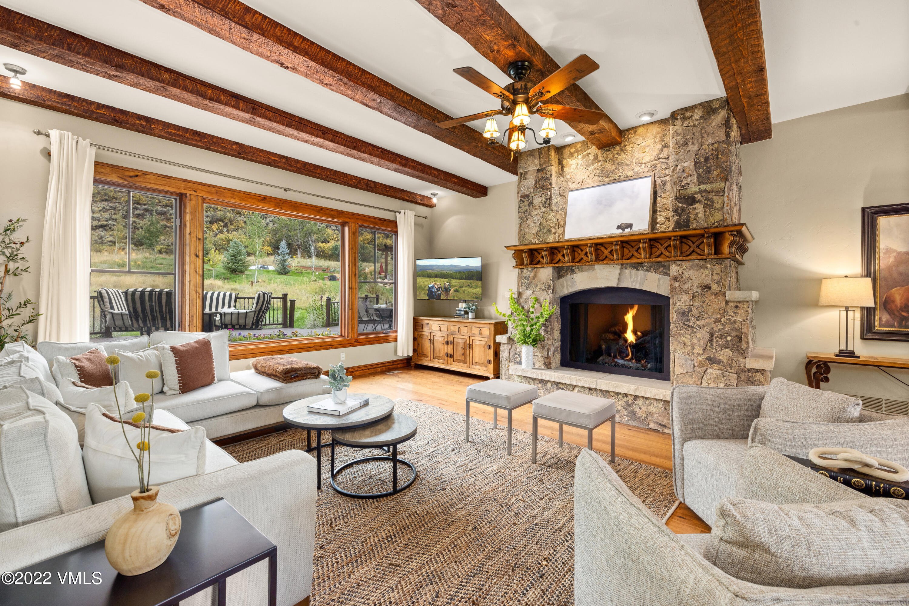 2376 Eagle Ranch Road Eagle, CO 81631 - Photo 4 of 52 a living room with furniture and a fireplace