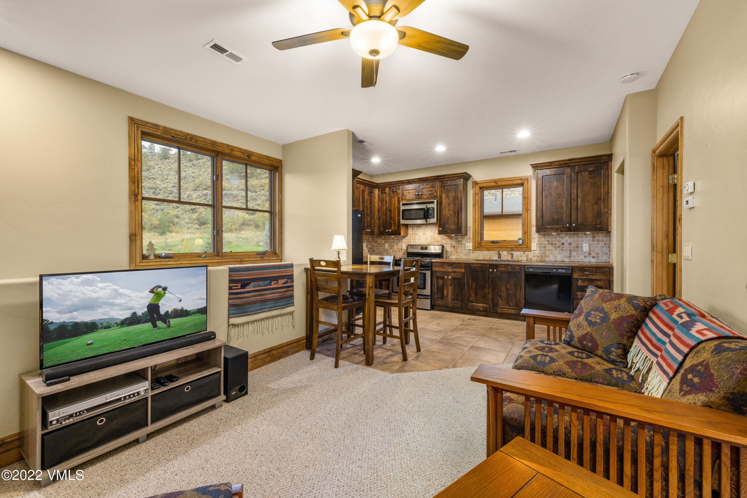 2376 Eagle Ranch Road Eagle, CO 81631 - Photo 42 of 52 a living room with furniture and a flat screen tv