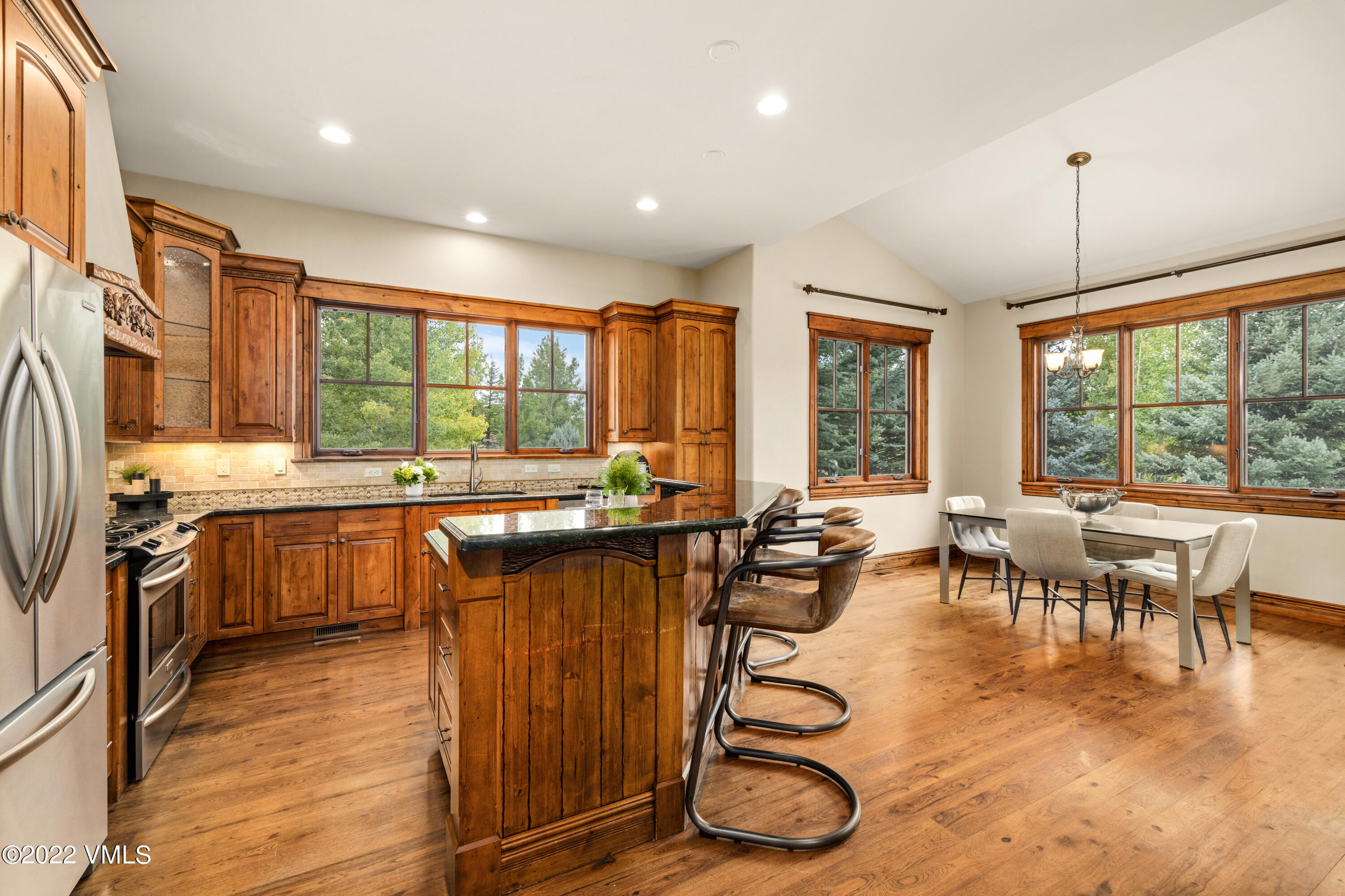 2376 Eagle Ranch Road Eagle, CO 81631 - Photo 10 of 52 a kitchen with lots of counter top space and dining table