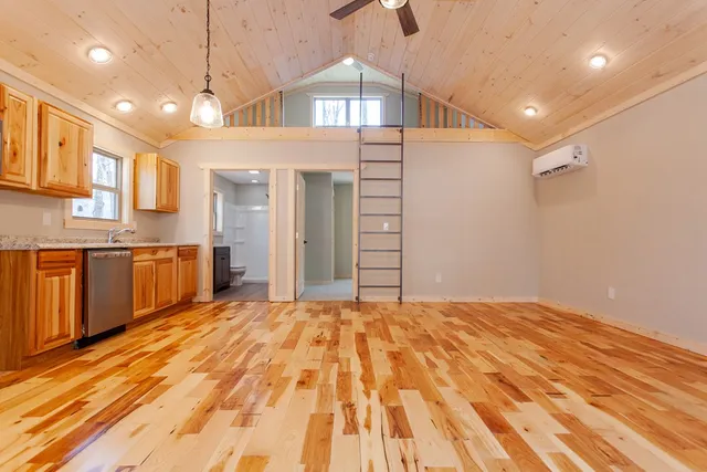 a spacious kitchen with stainless steel appliances kitchen island a large island in the center