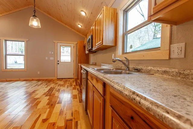 a spacious bathroom with a sink mirror vanity and toilet