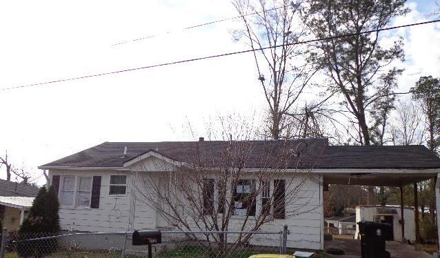 a view of a house with a tree