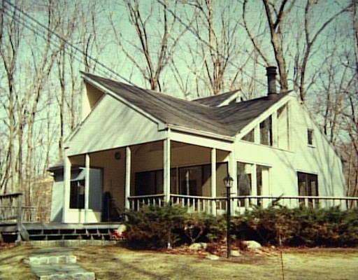 23 A Steep Hill Road Weston, CT 06883 - Photo 1 of 1 a view of a house with large windows and a tree