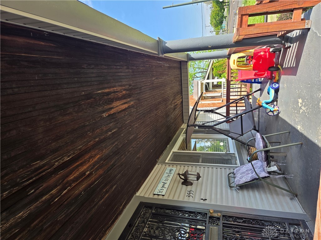 355 Elmhurst Road Dayton, OH 45417 - Photo 2 of 19 This inviting porch offers a warm welcome and versatile outdoor space for relaxation.