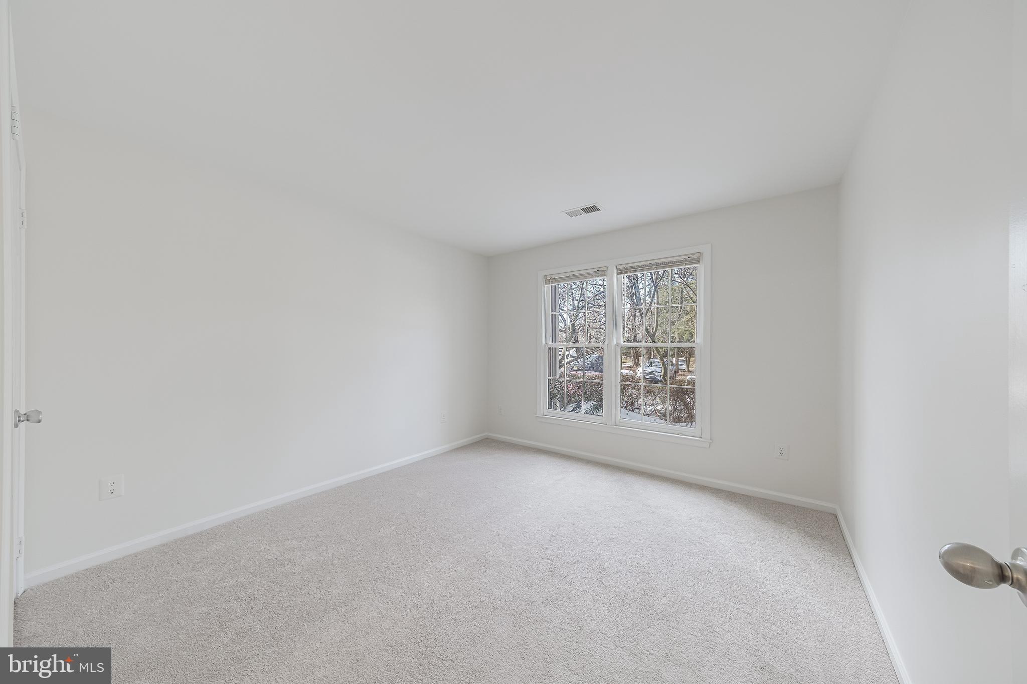 1427 Church Hill Place Reston, VA 20194 - Photo 17 of 30 a view of an empty room with a window