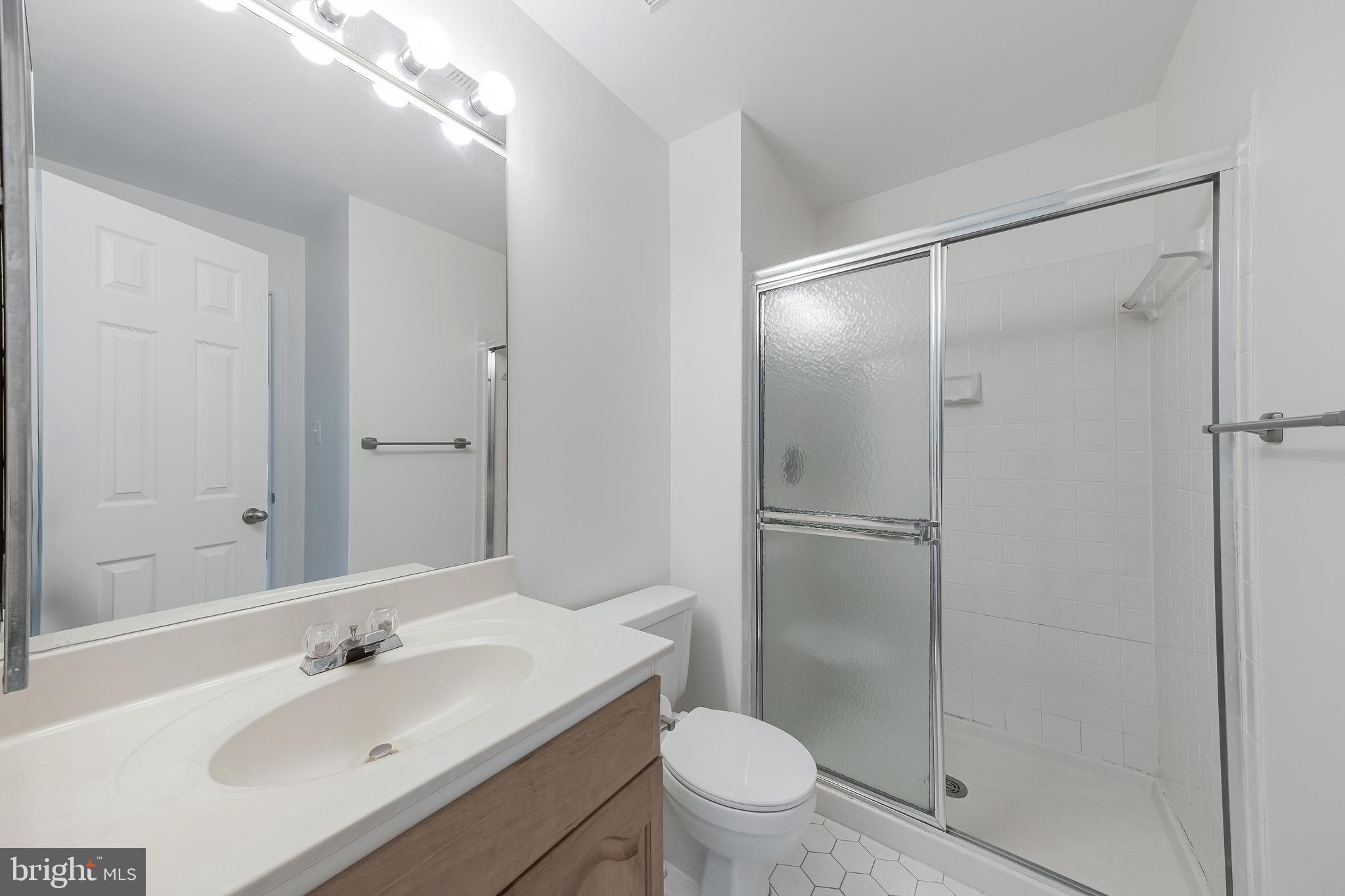 1427 Church Hill Place Reston, VA 20194 - Photo 20 of 30 a bathroom with a sink toilet and shower