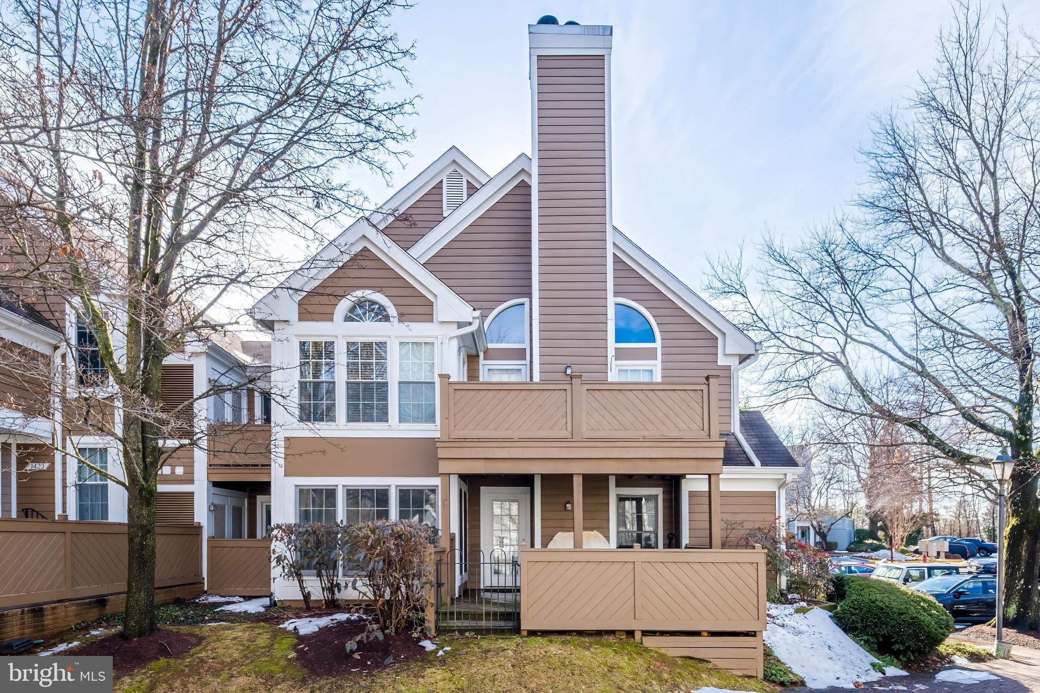 1427 Church Hill Place Reston, VA 20194 - Photo 30 of 30 a view of white house with a large windows and a tree