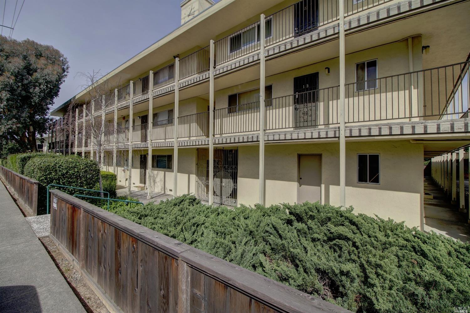 260 Merrydale Road, Unit 18 San Rafael, CA 94903 - Photo 1 of 1 a front view of a house with a yard