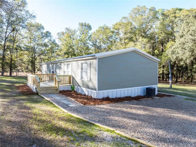 a house view with a backyard space