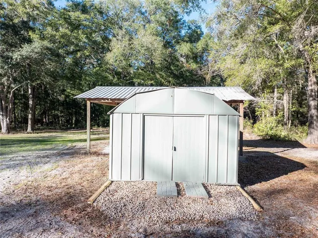 a backyard of a house with lots of green space