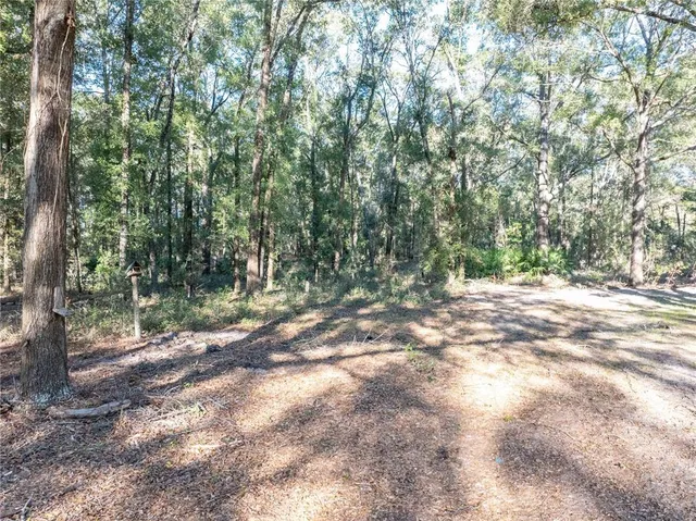a view of a swimming pool with an outdoor space and seating area