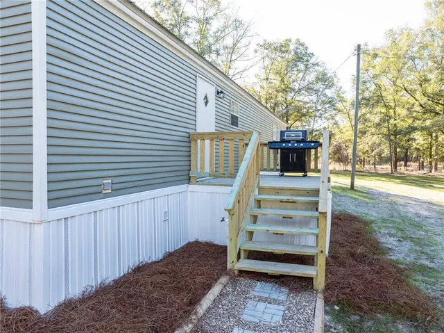 a view of a yard with large trees