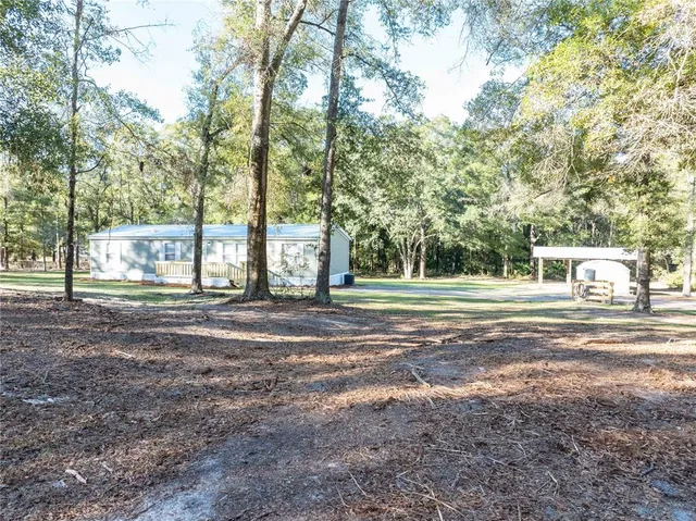 a view of a wooden door of the house