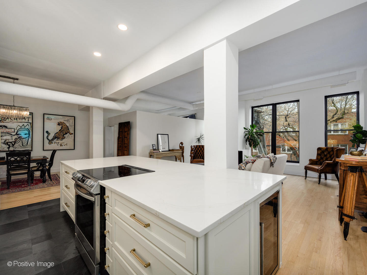 1760 West Wrightwood Avenue, Unit 204 Chicago, IL 60614 - Photo 12 of 28 a kitchen that has a sink a stove and chairs