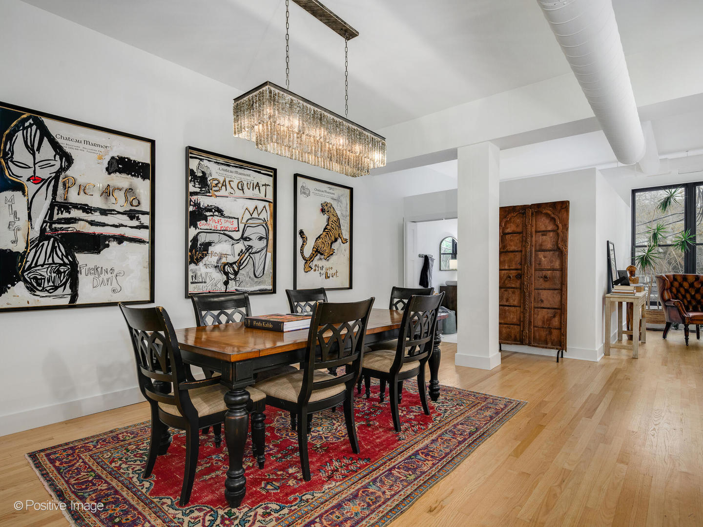 1760 West Wrightwood Avenue, Unit 204 Chicago, IL 60614 - Photo 13 of 28 a dining room with furniture wooden floor and painting on the wall