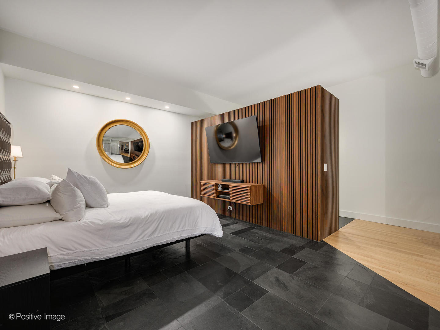 1760 West Wrightwood Avenue, Unit 204 Chicago, IL 60614 - Photo 17 of 28 a bedroom with a bed and a lamp on dresser