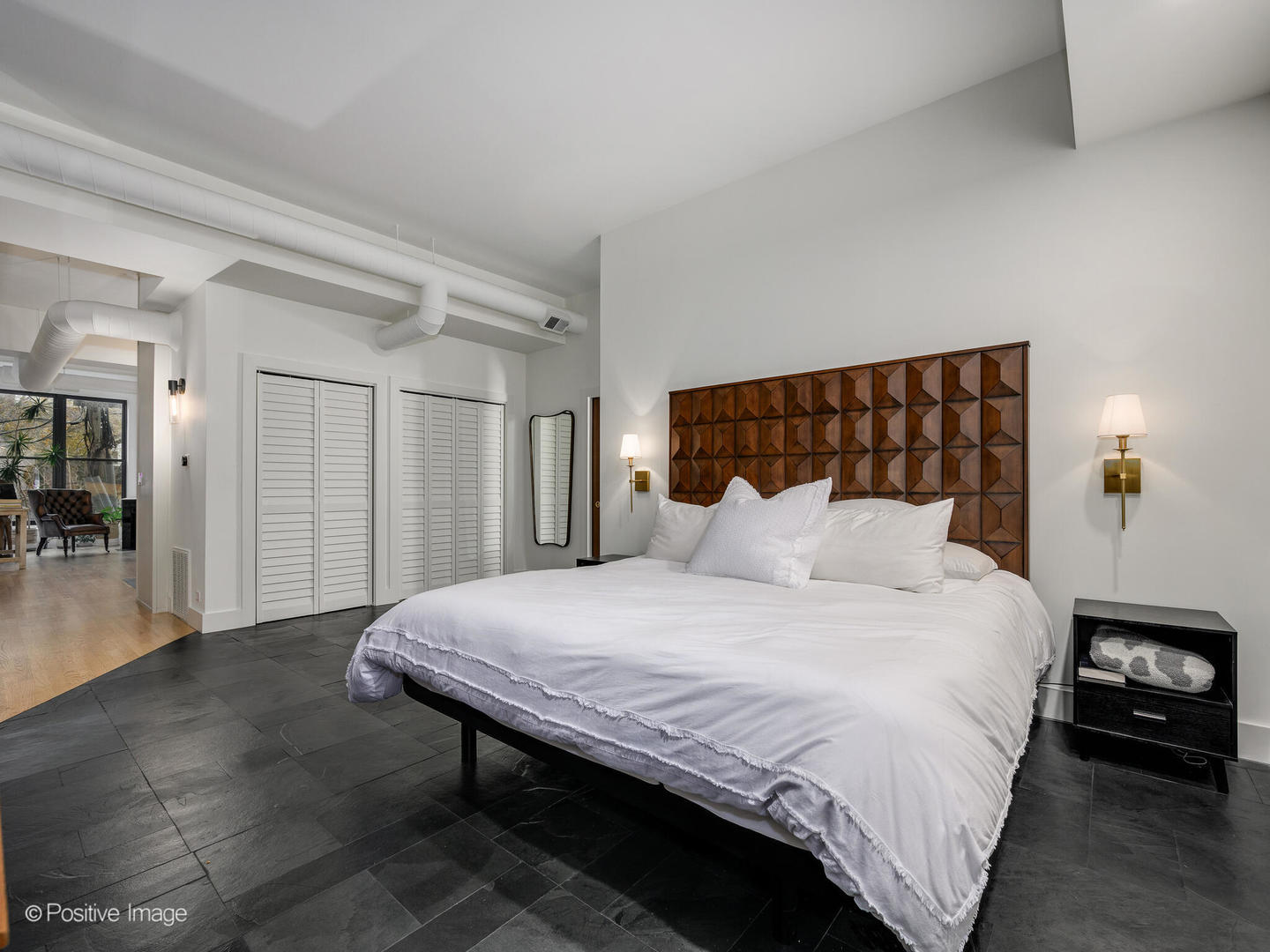 1760 West Wrightwood Avenue, Unit 204 Chicago, IL 60614 - Photo 18 of 28 a bedroom with a bed and a table