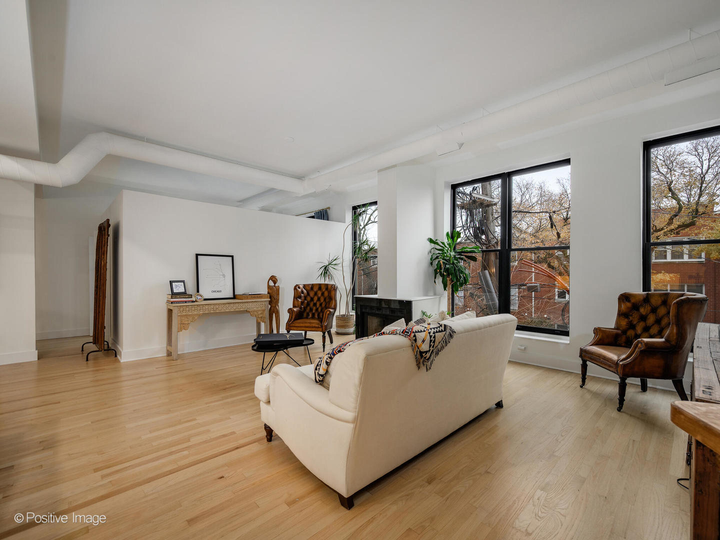 1760 West Wrightwood Avenue, Unit 204 Chicago, IL 60614 - Photo 6 of 28 a living room with furniture and large windows