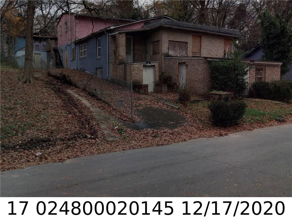 1124 Lookout Avenue Northwest Atlanta, GA 30318 - Photo 1 of 1 a black and white house with outdoor space