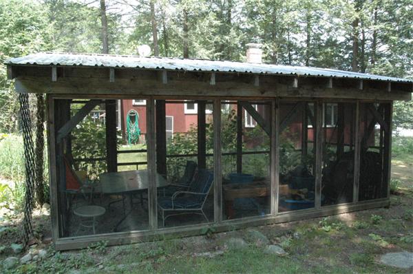 81 Intervale Road Orange, MA 01364 - Photo 4 of 13 a view of a porch with a table and chairs