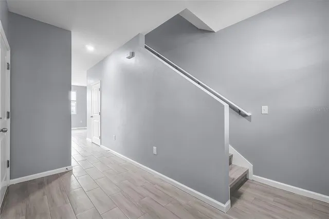 a view of entryway with wooden floor