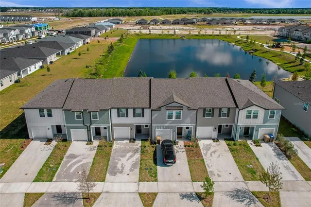 an aerial view of a house with swimming pool