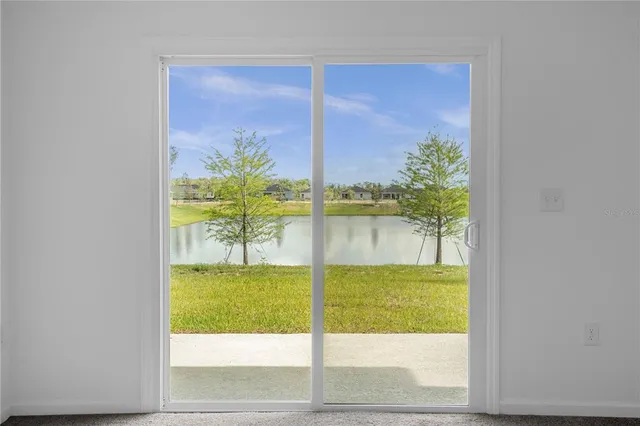 a view of an empty room and window