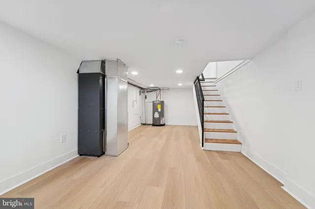 a view of an empty room with stairs