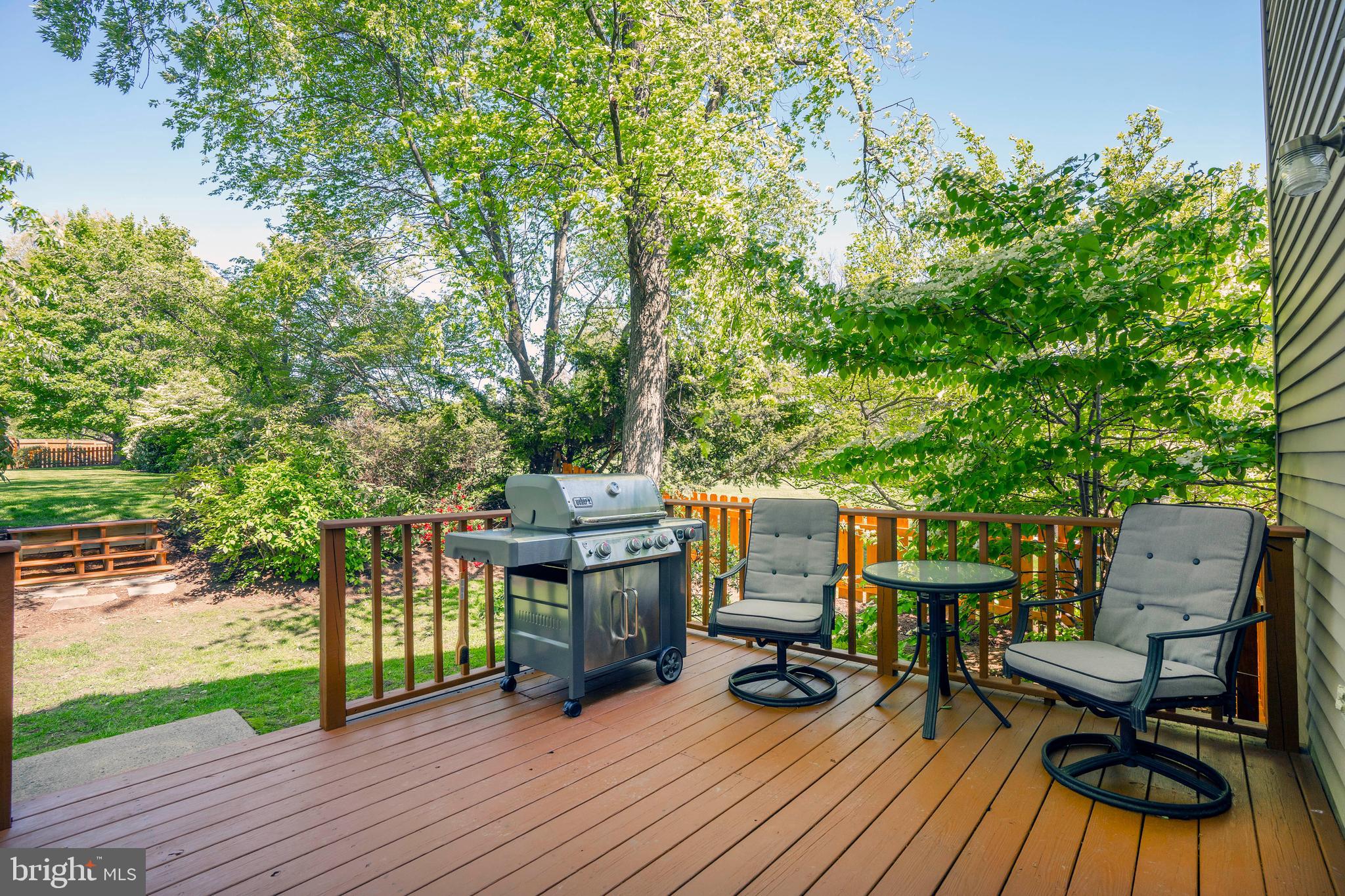 4 Kenwick Road Hockessin, DE 19707 - Photo 35 of 44 Deck and access to the large flat back yard.