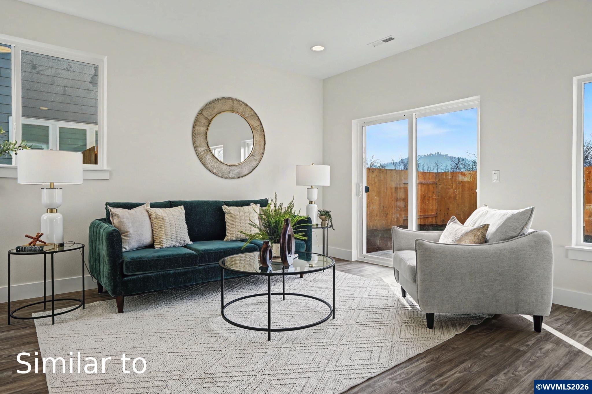 2550 Promise Way Lebanon, OR 97355 - Photo 6 of 35 a living room with furniture a table and a large window