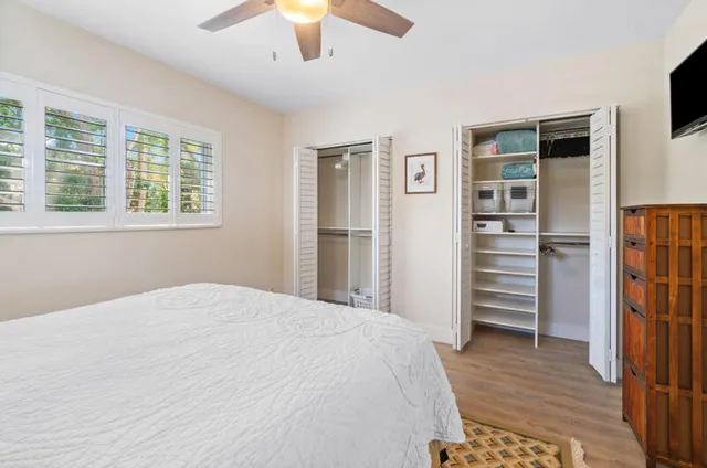 a bedroom with a bed and a walk in closet