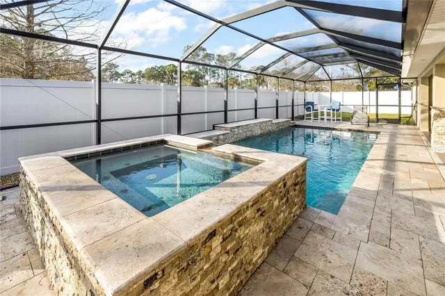 a view of a kitchen with a sink and wooden floor