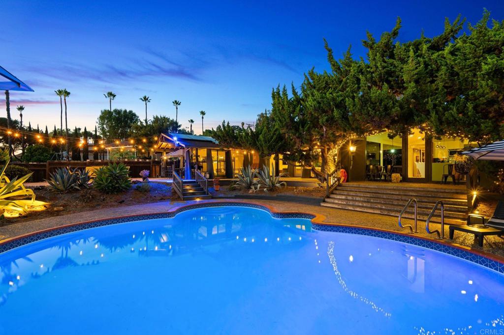 754 El Rancho Drive El Cajon, CA 92019 - Photo 45 of 55 a view of a swimming pool with an outdoor seating and a yard
