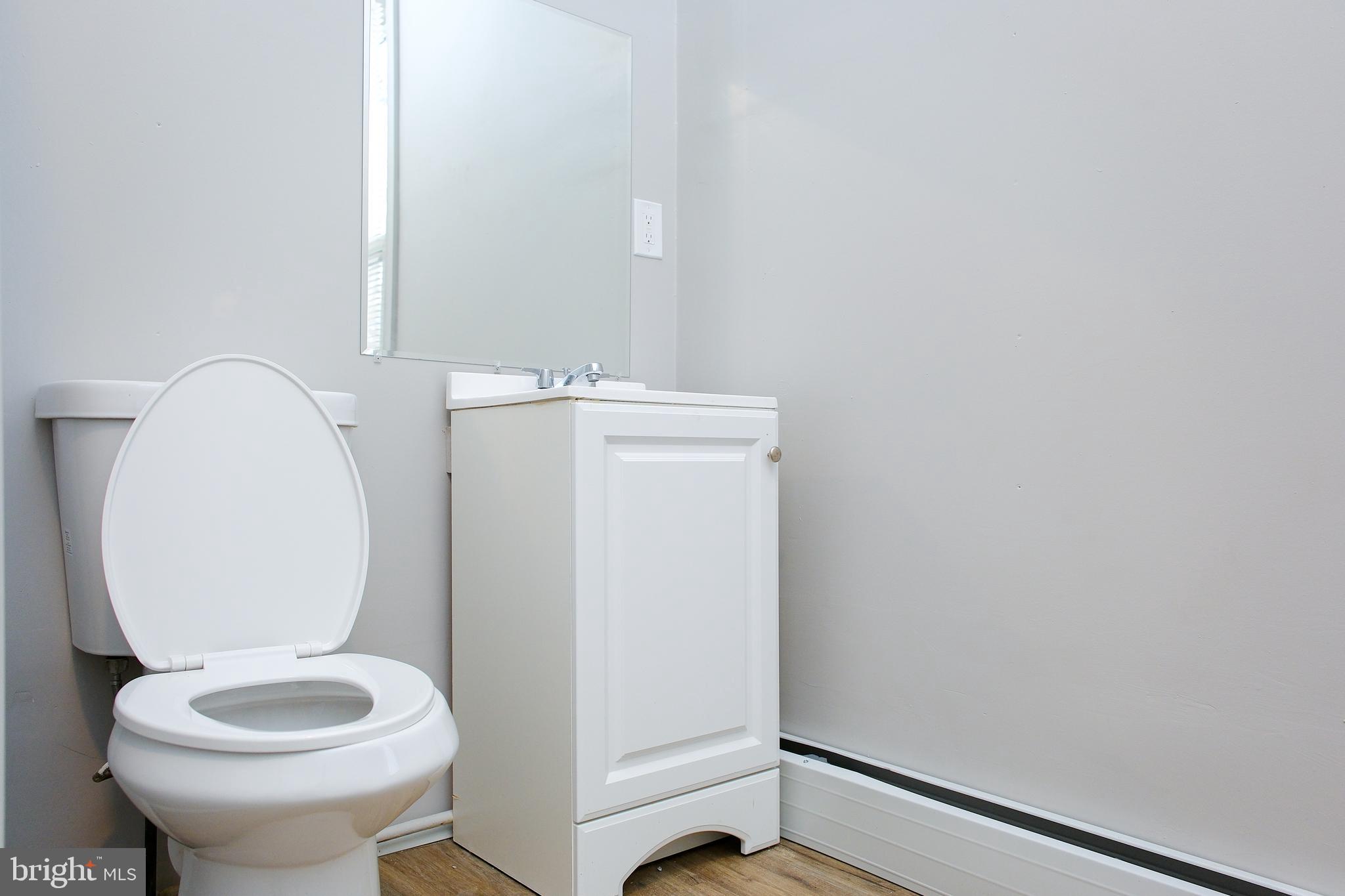 225 Front Street York, PA 17404 - Photo 12 of 42 a bathroom with a toilet and a sink