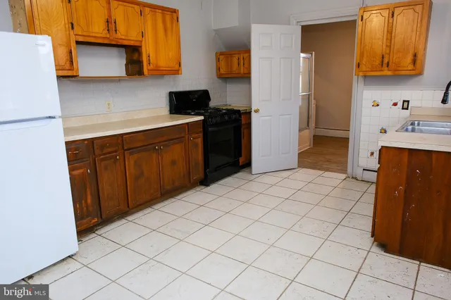 a kitchen with a cabinets and appliances