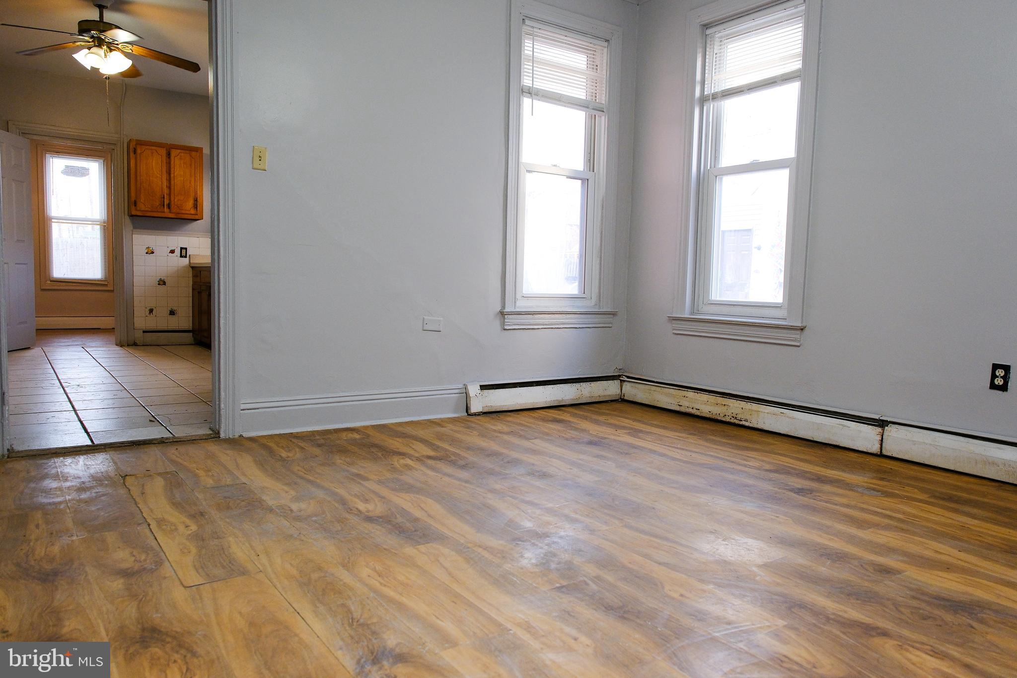 225 Front Street York, PA 17404 - Photo 19 of 42 an empty room with wooden floor and windows