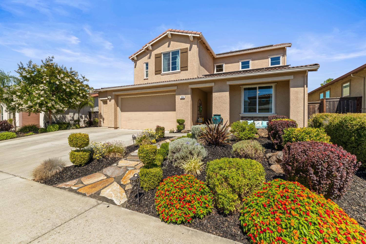 a front view of a house with sitting area