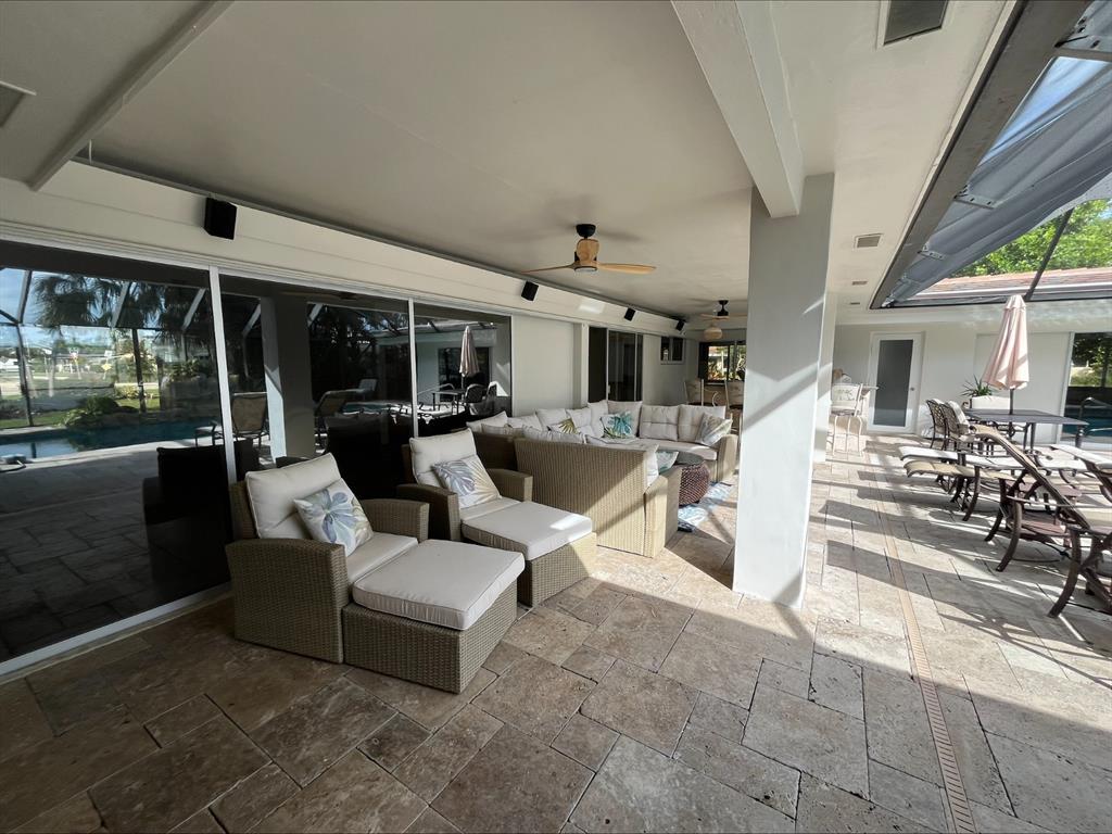 556 Southeast 15th Avenue Deerfield Beach, FL 33441 - Photo 12 of 42 a living room with furniture and large windows
