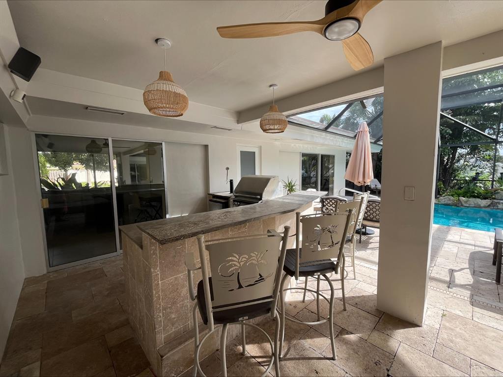 556 Southeast 15th Avenue Deerfield Beach, FL 33441 - Photo 13 of 42 a view of a dining room with furniture and wooden floor