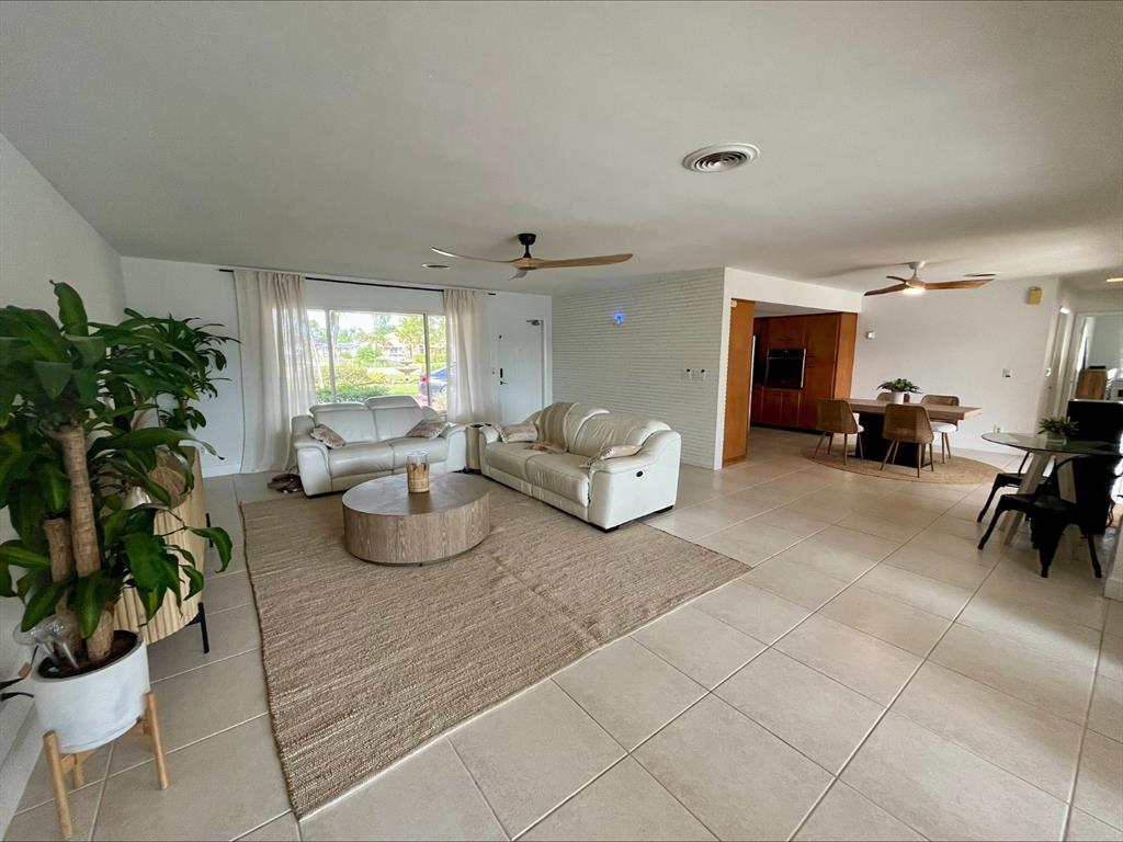 556 Southeast 15th Avenue Deerfield Beach, FL 33441 - Photo 19 of 42 a living room with furniture potted plant and a large window