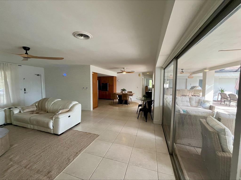 556 Southeast 15th Avenue Deerfield Beach, FL 33441 - Photo 20 of 42 a living room with furniture and a table