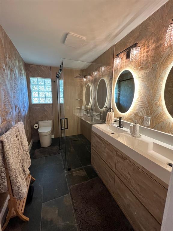 556 Southeast 15th Avenue Deerfield Beach, FL 33441 - Photo 27 of 42 a bathroom with a double vanity sink and a mirror