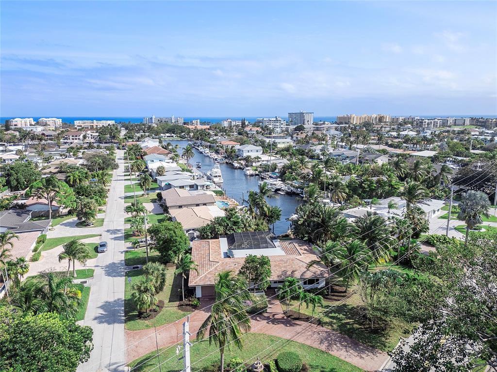556 Southeast 15th Avenue Deerfield Beach, FL 33441 - Photo 3 of 42 an aerial view of residential building with green space