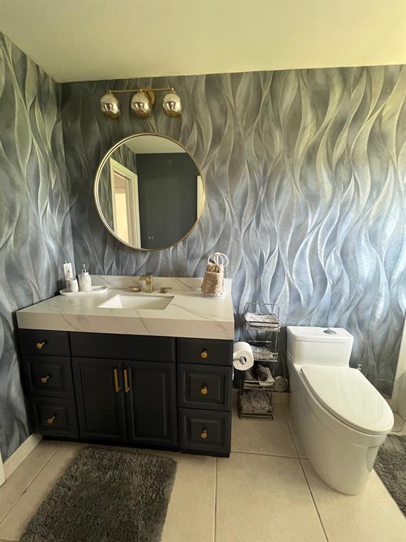 556 Southeast 15th Avenue Deerfield Beach, FL 33441 - Photo 32 of 42 a bathroom with a sink and a mirror