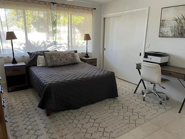 a bathroom with a double vanity sink toilet and shower