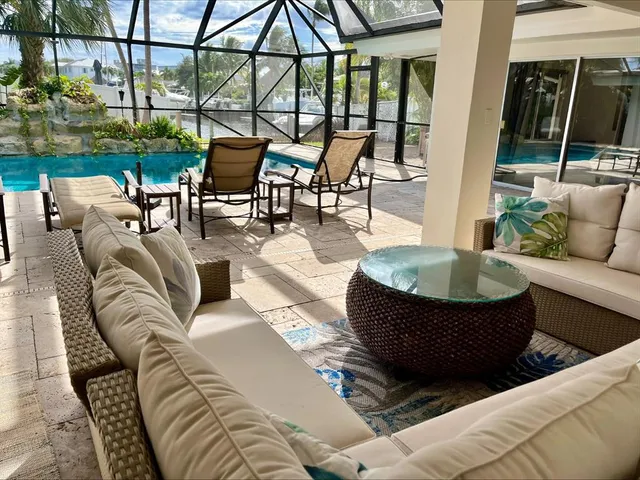 a view of a swimming pool with a patio