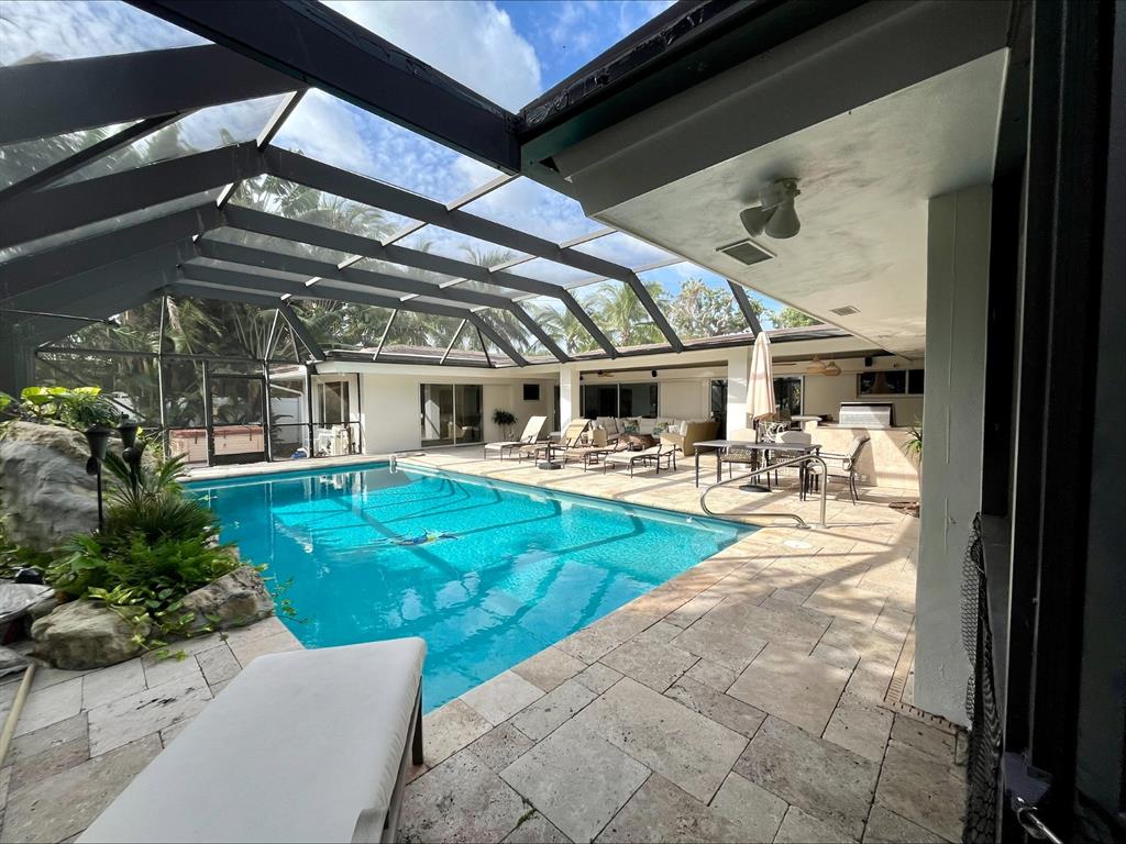 556 Southeast 15th Avenue Deerfield Beach, FL 33441 - Photo 9 of 42 a view of a swimming pool with a patio