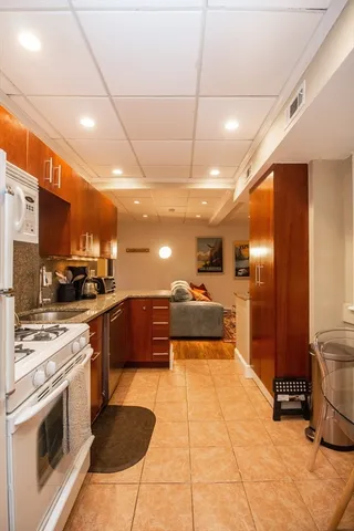 a bedroom with a bed and a night stand