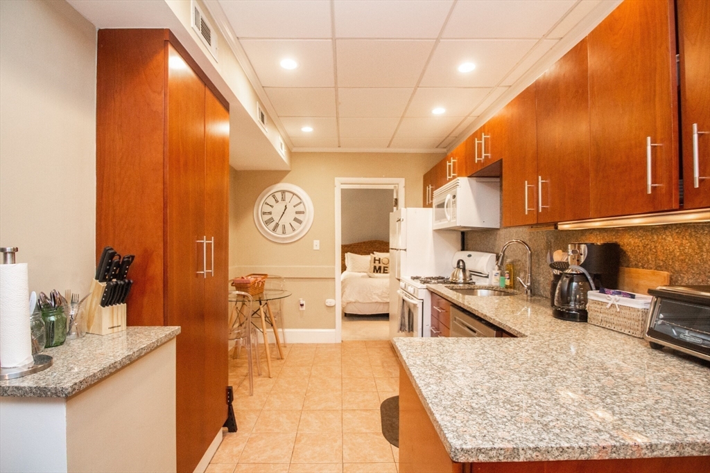 1253 Beacon Street, Unit 4BB Brookline, MA 02446 - Photo 8 of 18 a large kitchen with lots of counter top space